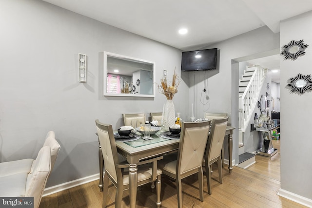 dining room with hardwood / wood-style flooring