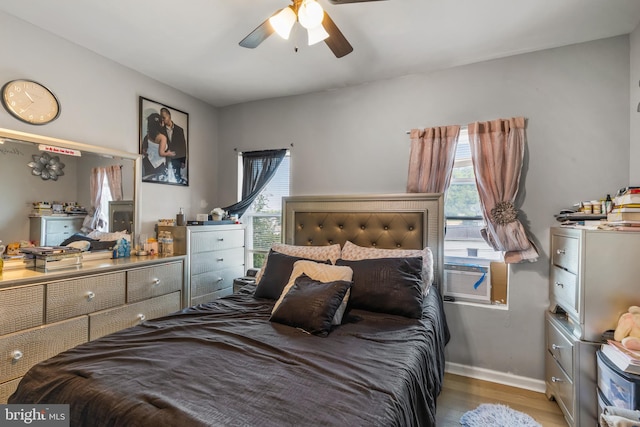 bedroom featuring ceiling fan and wood-type flooring