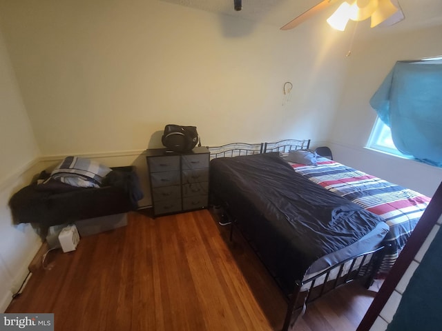 bedroom featuring hardwood / wood-style flooring and ceiling fan