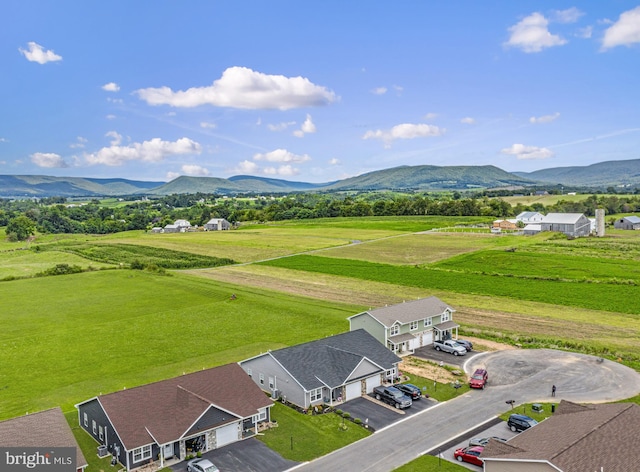 drone / aerial view featuring a mountain view and a rural view