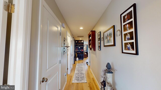 hallway featuring light hardwood / wood-style flooring