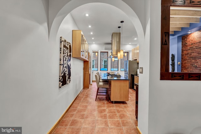 hallway with light tile patterned floors