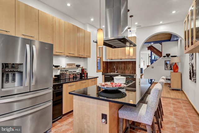 kitchen with light hardwood / wood-style flooring, decorative light fixtures, island range hood, a kitchen island, and stainless steel fridge with ice dispenser