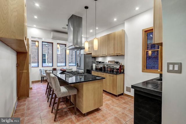 kitchen featuring a center island, pendant lighting, light brown cabinets, and island range hood