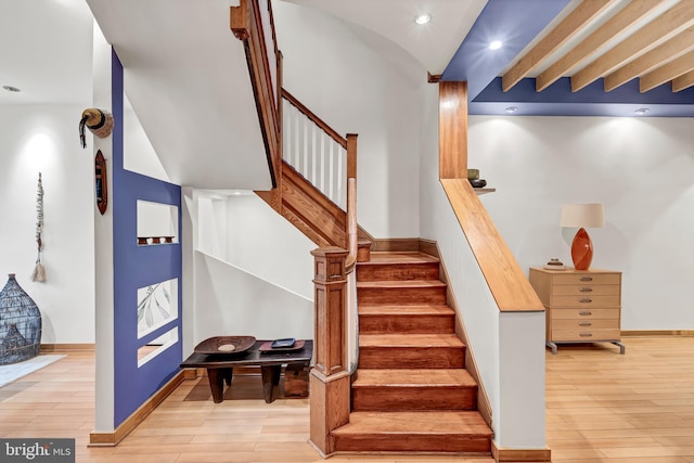 stairway featuring hardwood / wood-style flooring