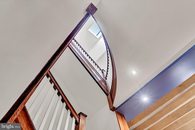 staircase featuring wood-type flooring