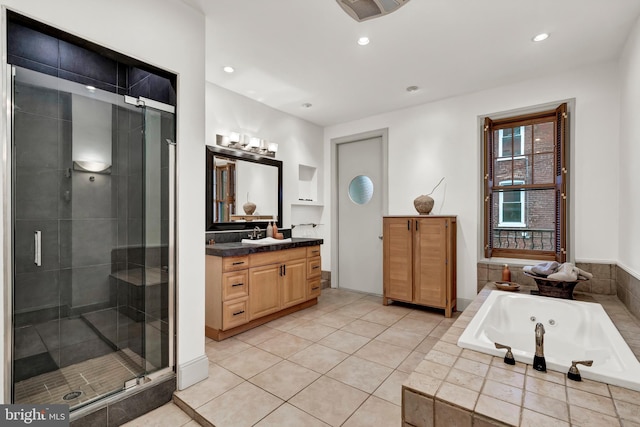 bathroom with vanity, plus walk in shower, and tile patterned floors