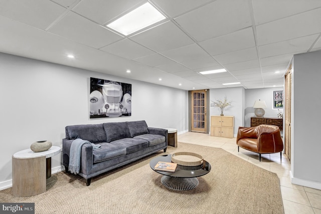 tiled living room with a drop ceiling