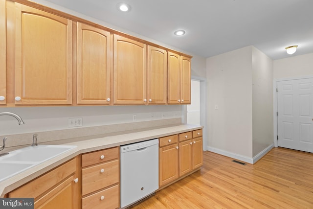 kitchen featuring light hardwood / wood-style flooring, dishwasher, light brown cabinetry, and sink