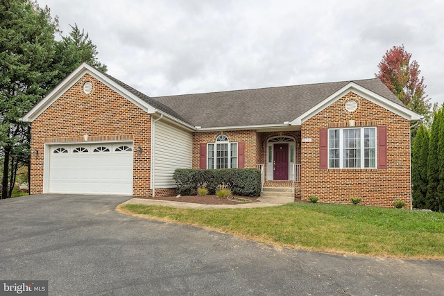 ranch-style house featuring a garage and a front lawn