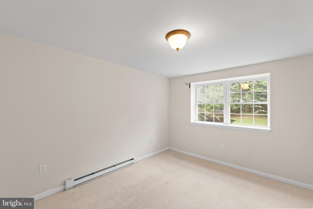 carpeted empty room featuring a baseboard radiator