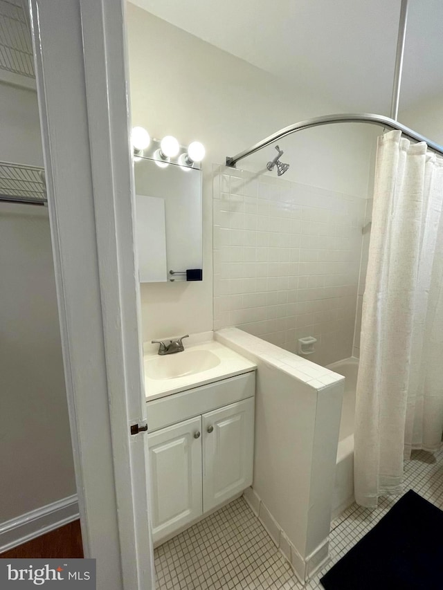 bathroom with vanity and shower / bathtub combination with curtain