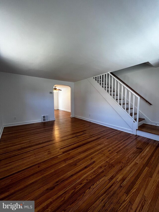 unfurnished living room featuring wood-type flooring