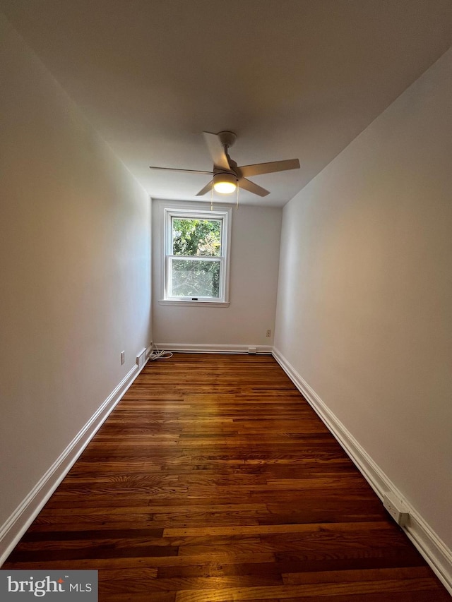 spare room featuring ceiling fan and hardwood / wood-style floors