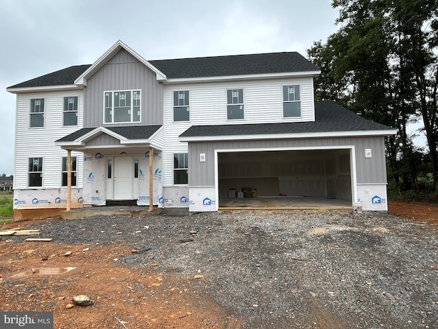 view of front of home with a garage and covered porch