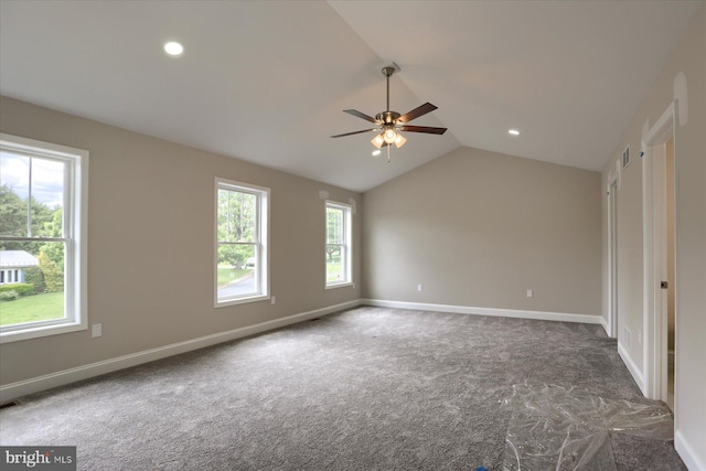 carpeted empty room with ceiling fan and vaulted ceiling