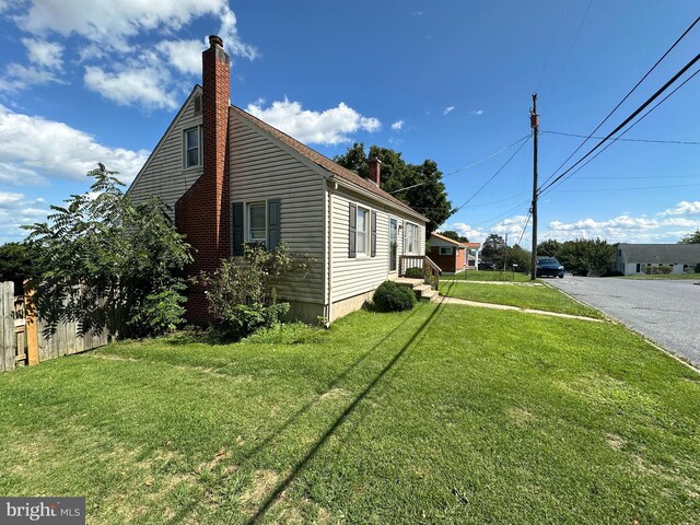 view of home's exterior with a lawn