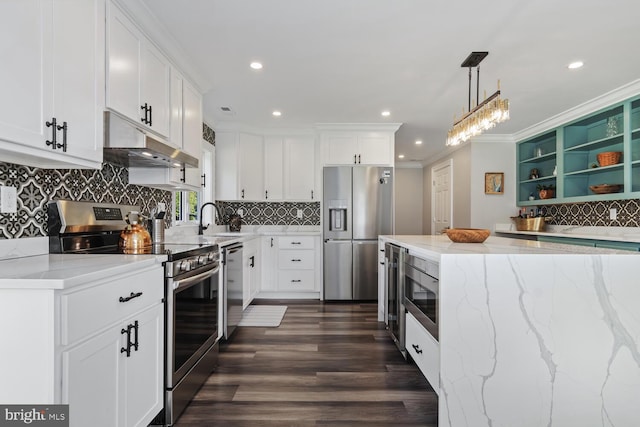 kitchen with dark hardwood / wood-style flooring, appliances with stainless steel finishes, and white cabinets