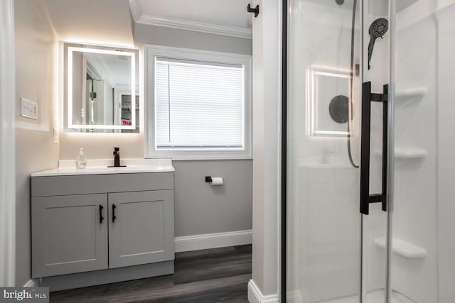 full bathroom featuring a stall shower, ornamental molding, and vanity