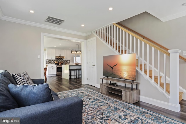 living room featuring visible vents, dark wood finished floors, stairway, crown molding, and recessed lighting