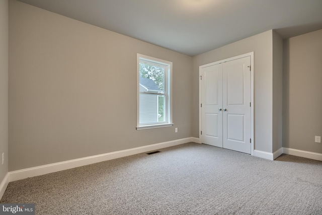 empty room featuring carpet flooring