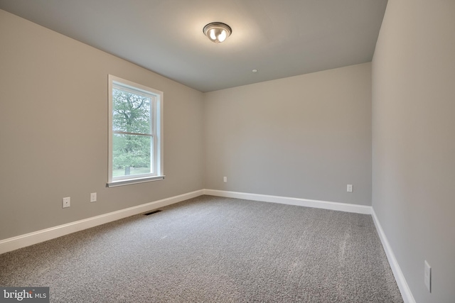 unfurnished room with carpet floors