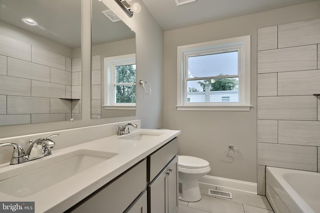 full bathroom featuring vanity, toilet, and separate shower and tub