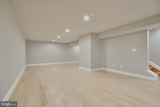 basement featuring light hardwood / wood-style flooring