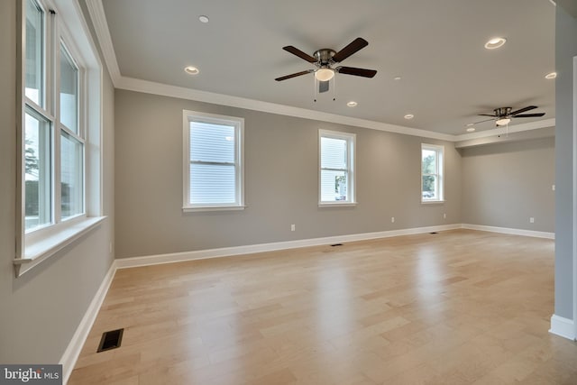 unfurnished room featuring light wood-type flooring, ceiling fan, and crown molding