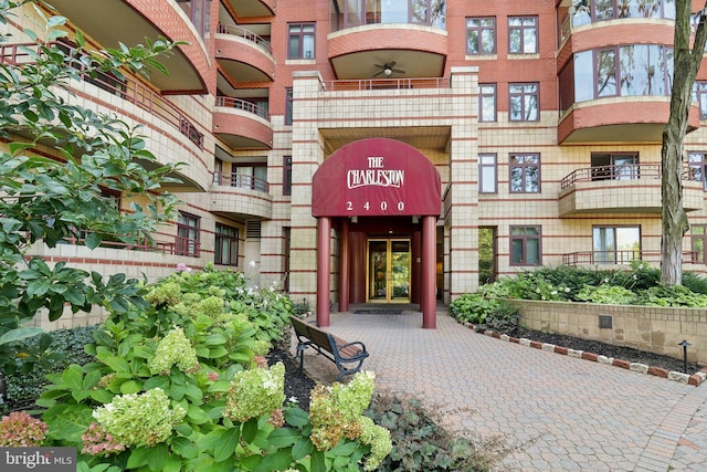 entrance to property featuring brick siding