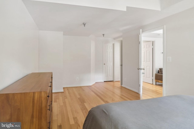 bedroom with light hardwood / wood-style floors