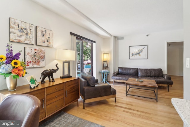 sitting room with visible vents and light wood-style flooring