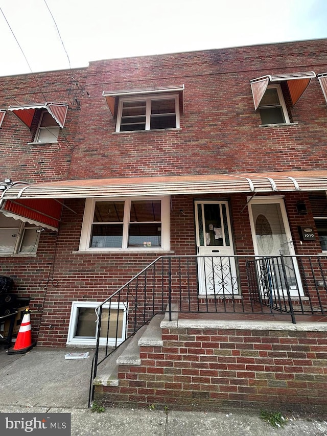 view of property featuring a porch