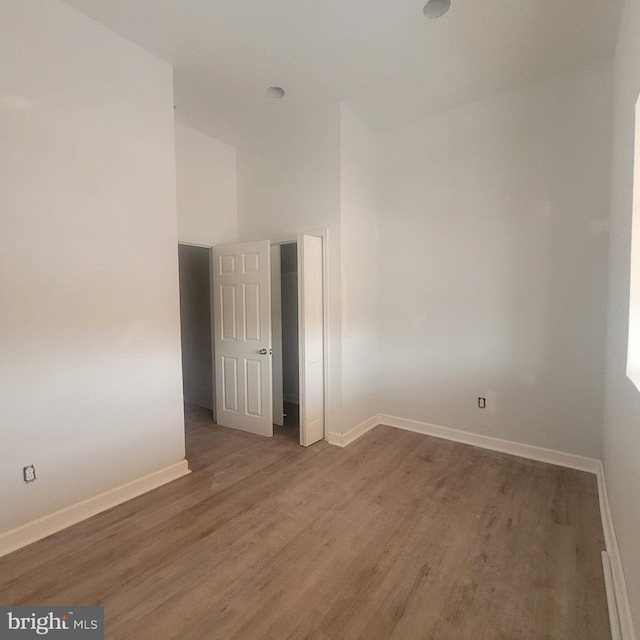 empty room with wood-type flooring