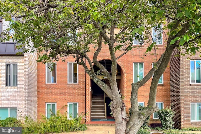 view of property featuring stairway