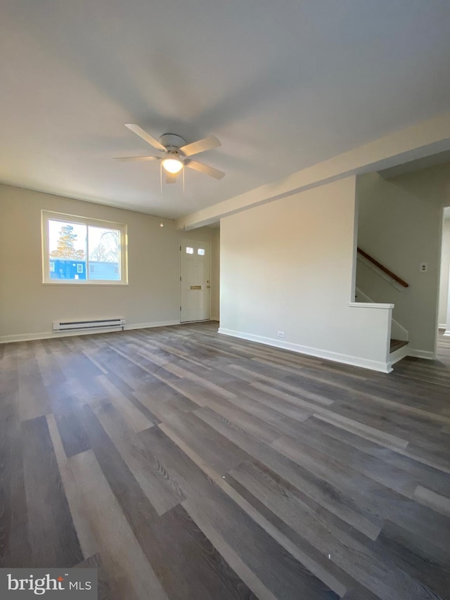 empty room with a baseboard heating unit, ceiling fan, and dark hardwood / wood-style floors