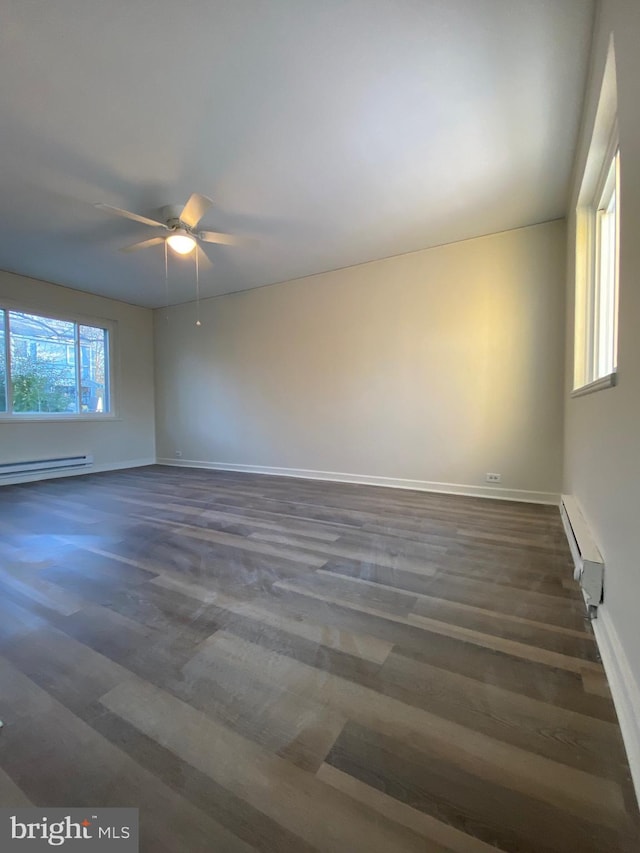 spare room featuring ceiling fan and a baseboard radiator