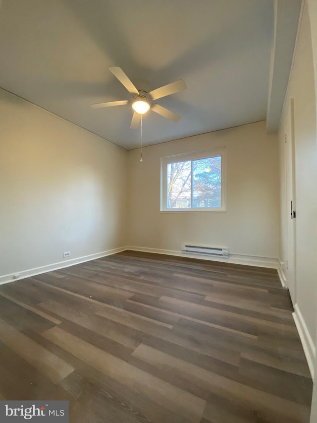 unfurnished room with ceiling fan, baseboard heating, and dark hardwood / wood-style flooring