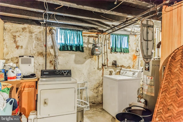 interior space with water heater, laundry area, and washer and clothes dryer