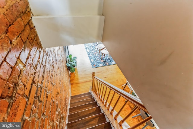 staircase with wood finished floors