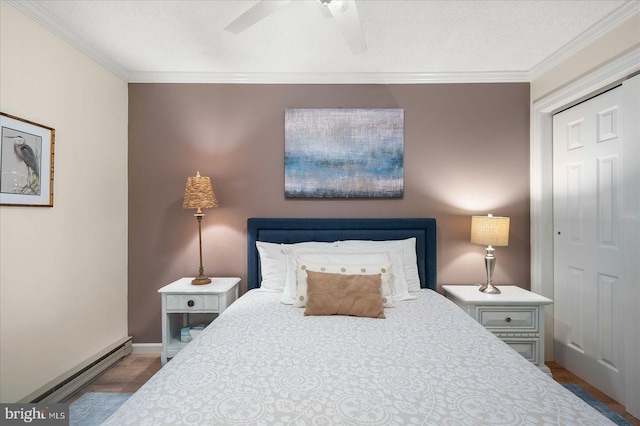 bedroom with a baseboard radiator, ceiling fan, ornamental molding, wood finished floors, and a textured ceiling