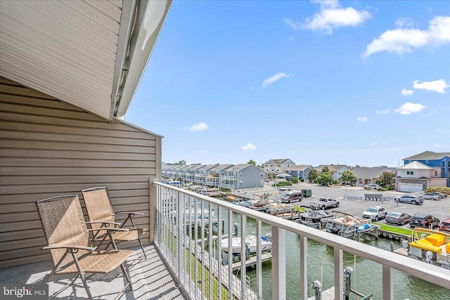 balcony featuring a water view