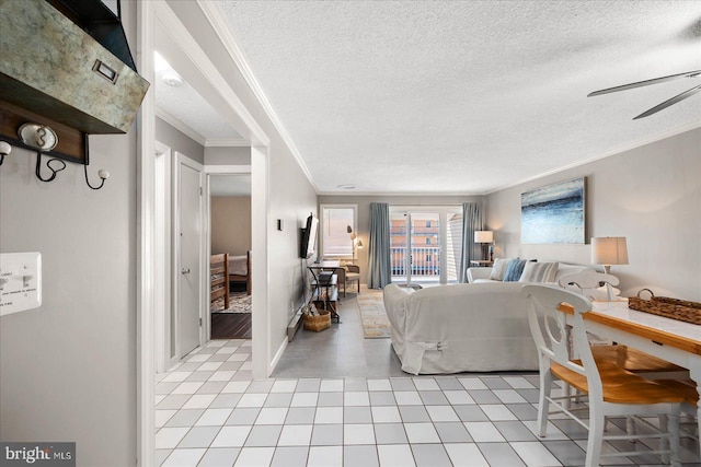 bedroom with light tile patterned floors, a textured ceiling, and crown molding