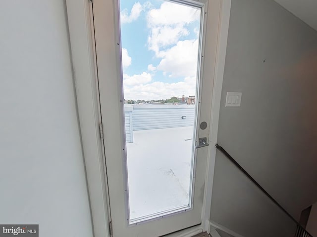 doorway to outside featuring plenty of natural light