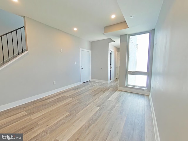 unfurnished room featuring light hardwood / wood-style floors