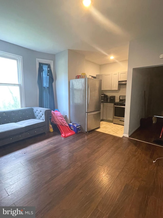 interior space featuring wood-type flooring and stainless steel appliances