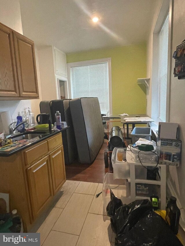 kitchen with light hardwood / wood-style floors and sink