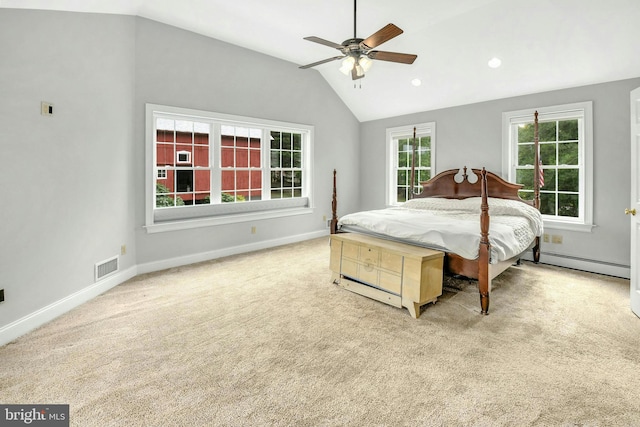 bedroom featuring light colored carpet, visible vents, vaulted ceiling, and baseboard heating