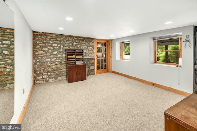 unfurnished living room with baseboards, carpet flooring, and recessed lighting