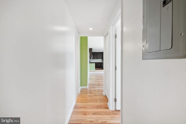 corridor with light wood-type flooring